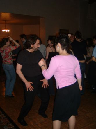 Students dancing at a party. Students dancing at a party.