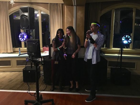 Students singing karaoke. Students singing karaoke.