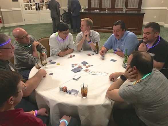 Group playing poker. Group playing poker.