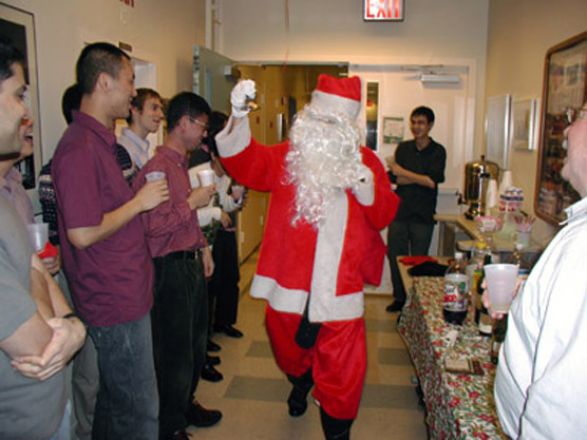 Students and faculty enjoy Holiday Party 2002.