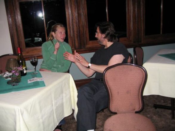 Students talking at a table.